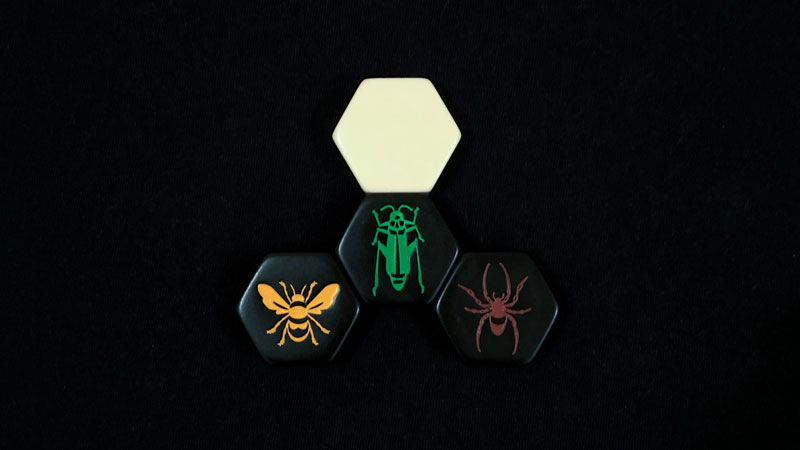 hive strategy - grasshopper, spider and queen bee on a dark background