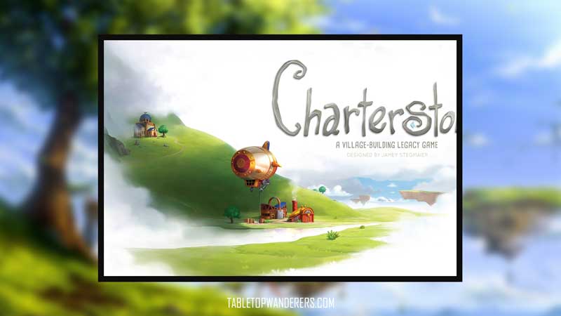 best city building games Charterstone game cover on a defocused bg